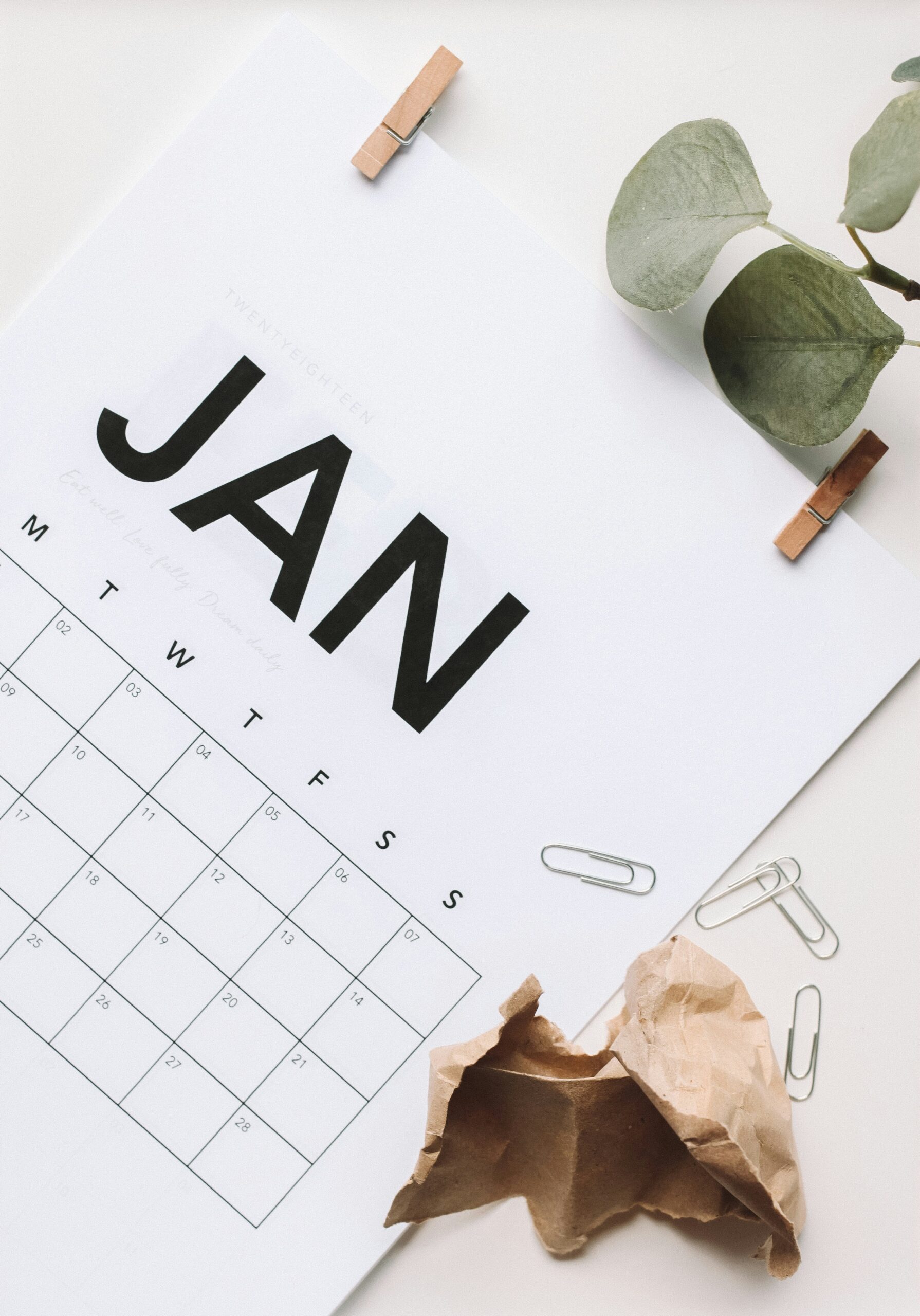 calendar of January on desk with paperclips